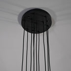 Modern dining room chandelier with clear crystal shades and black metal fixture