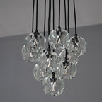 Modern dining room chandelier with clear crystal shades and black metal fixture