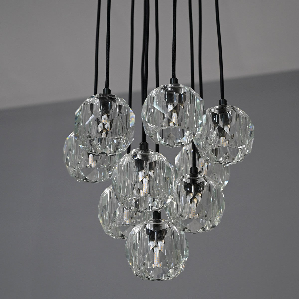 Modern dining room chandelier with clear crystal shades and black metal fixture