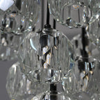 Modern dining room chandelier with clear crystal shades and black metal fixture